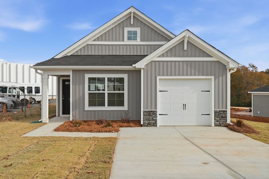 Front exterior of a new home in South Welcome, Greenville, SC, highlighting curb appeal (Image 2).