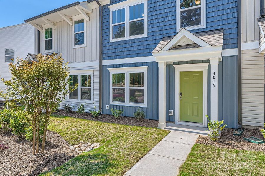 Front exterior of a new home in Dukes Ridge, Charlotte, NC, highlighting curb appeal (Image 27).