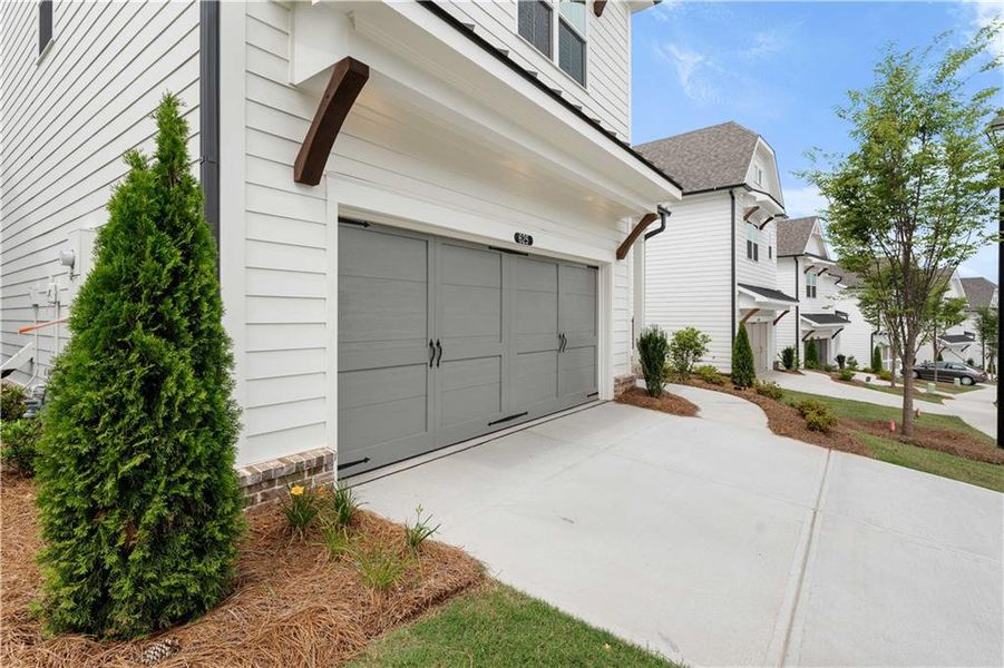 Front exterior of a new home in Palisades Single Family, Cumming, GA, highlighting curb appeal (Image 33).