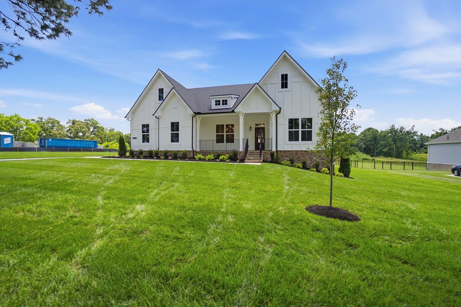 Front exterior of a new home in Belvoir, Fairview, TN, highlighting curb appeal (Image 23). Front exterior of a new home in Belvoir, Fairview, TN, highlighting curb appeal (Image 23).