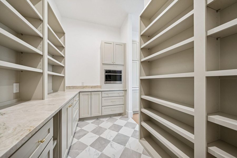 Walk-in butler's pantry with built in appliances