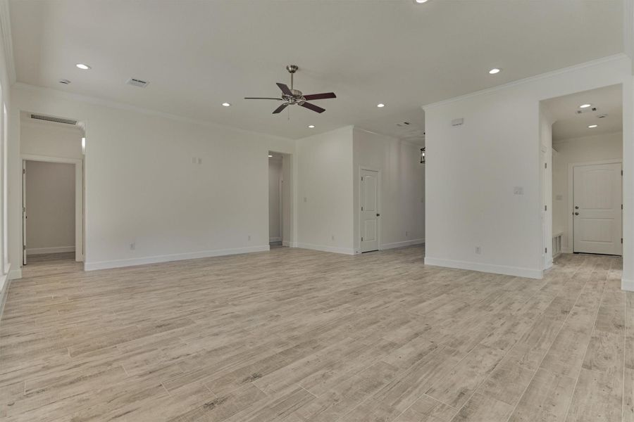 Bring all your large furniture pieces to personalize this incredible den. Note: the hallway to the utility room and "drop zone" from garage. Bring all your large furniture pieces to personalize this incredible den. Note: the hallway to the utility room and "drop zone" from garage.