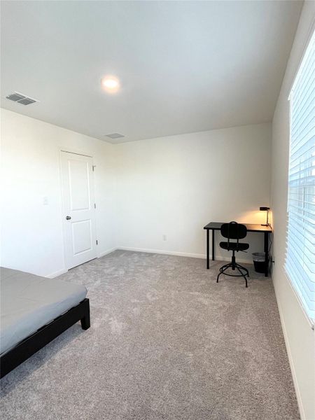 Unfurnished office with light colored carpet