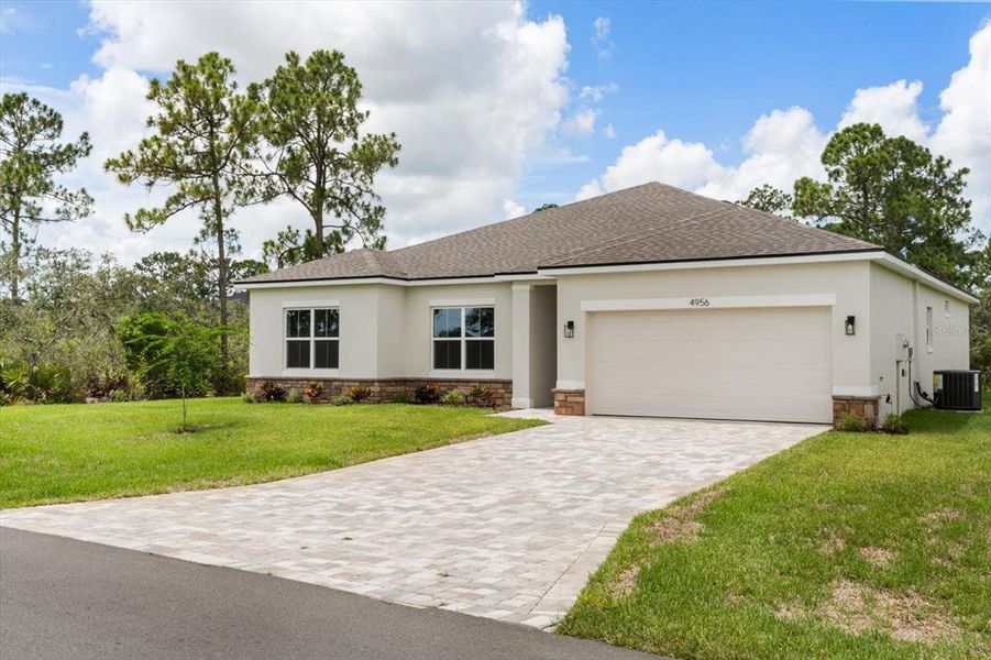 Front exterior of a new home in , Homosassa, FL, highlighting curb appeal (Image 2). Front exterior of a new home in , Homosassa, FL, highlighting curb appeal (Image 2).