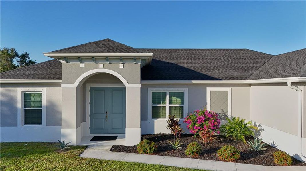 Front exterior of a new home in , North Port, FL, highlighting curb appeal (Image 27).