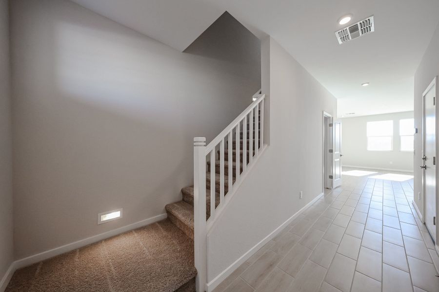 A hallway with white walls. A hallway with white walls.