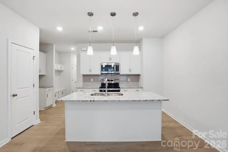 Furnished interior view inside a new home in Sloan Station, Charlotte (Image 7).