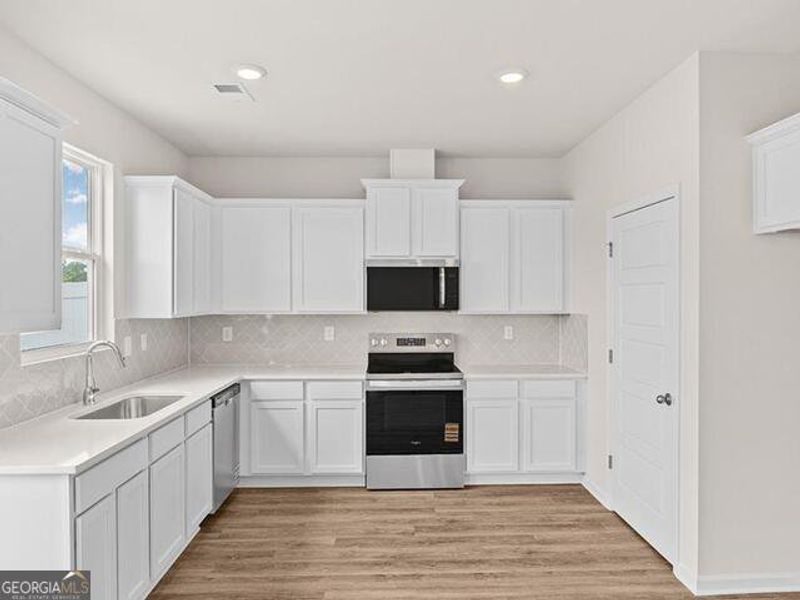 Furnished interior view inside a new home in Remington Chase, Perry (Image 5).