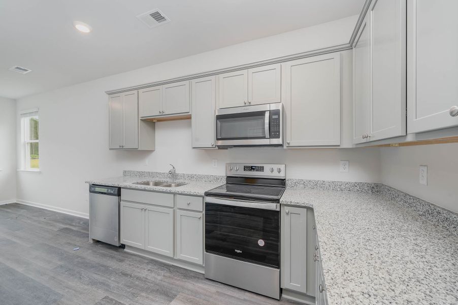 Representative furnished interior of a home built from the SULLIVAN by D.R. Horton in Summerville, Darlington (Image 6).