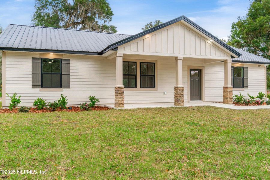 Front exterior of a new home in , San Mateo, FL, highlighting curb appeal (Image 32). Front exterior of a new home in , San Mateo, FL, highlighting curb appeal (Image 32).