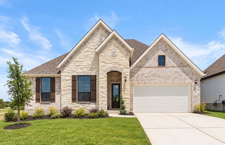 Front exterior of a new home in 6 Creeks, Kyle, TX, highlighting curb appeal (Image 29). Front exterior of a new home in 6 Creeks, Kyle, TX, highlighting curb appeal (Image 29).
