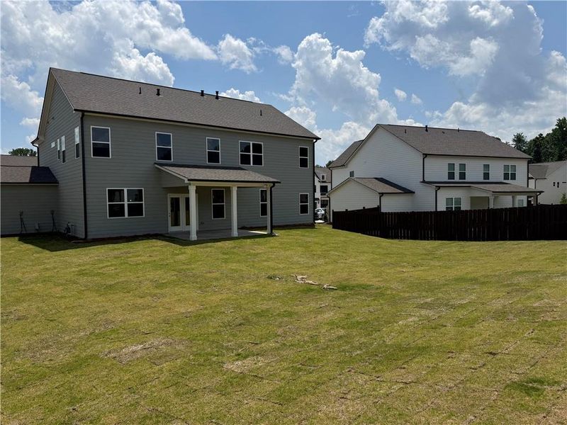 Exterior details and patio area of a home in Rosewood Lake Estates, Hoschton (Image 20).