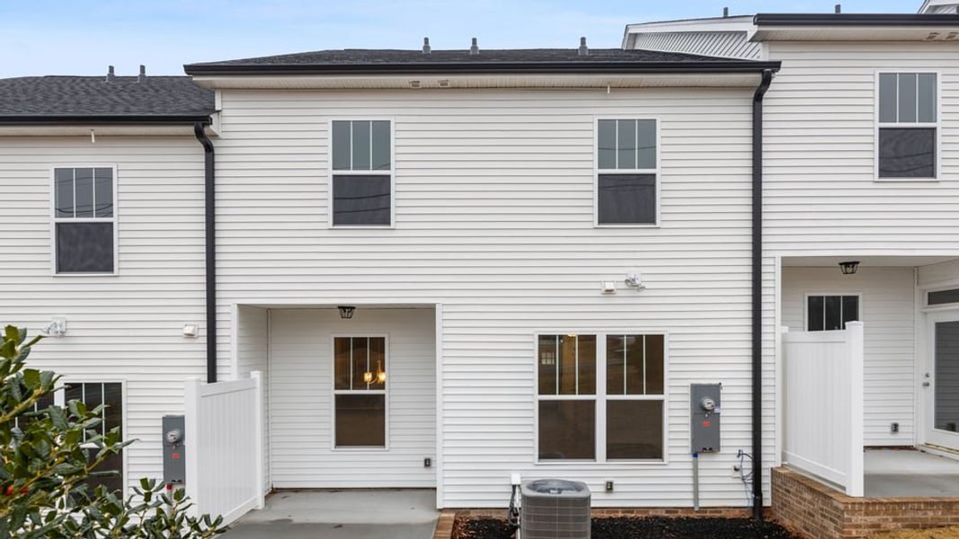 Exterior details and patio area of a home in Pearson Road Townhomes, Easley (Image 4).