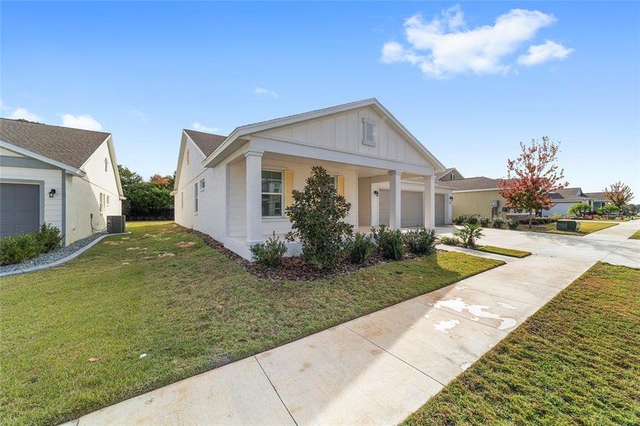 Front exterior of a new home in Calesa Township, Ocala, FL, highlighting curb appeal (Image 33).