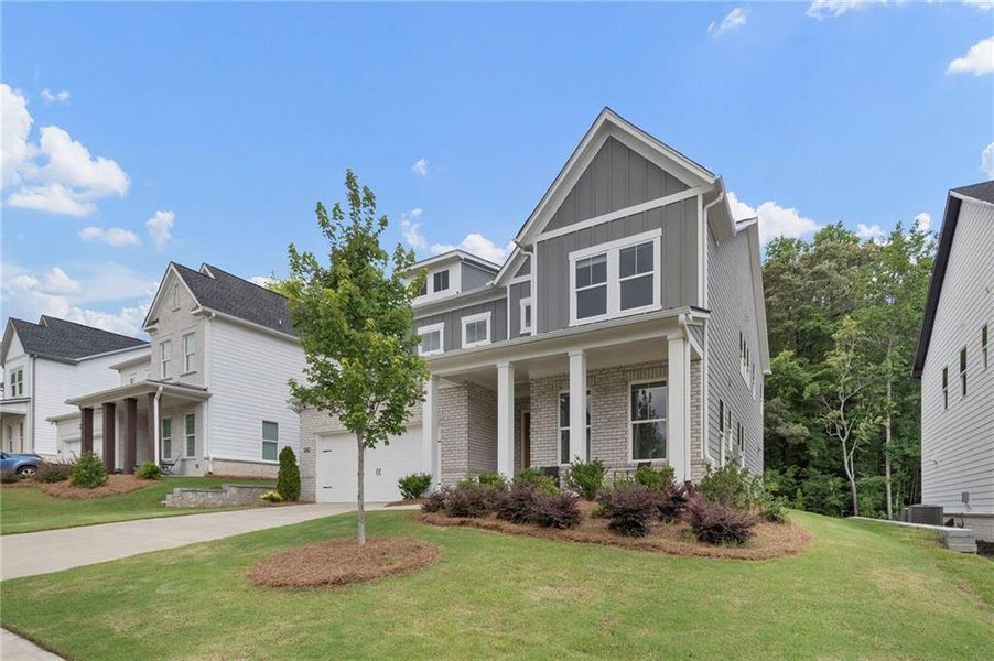 Front exterior of a new home in , Woodstock, GA, highlighting curb appeal (Image 2). Front exterior of a new home in , Woodstock, GA, highlighting curb appeal (Image 2).