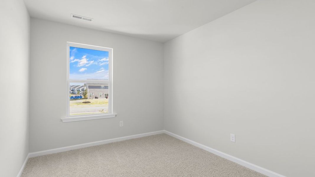 Spacious, unfurnished interior of a new home in The Townes at Belle Grove, Wendell (Image 28).