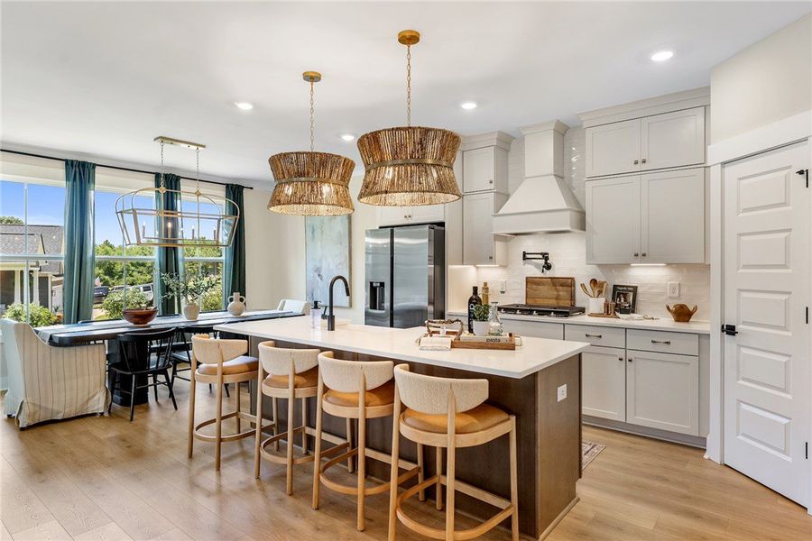 This bright kitchen features an expansive island,