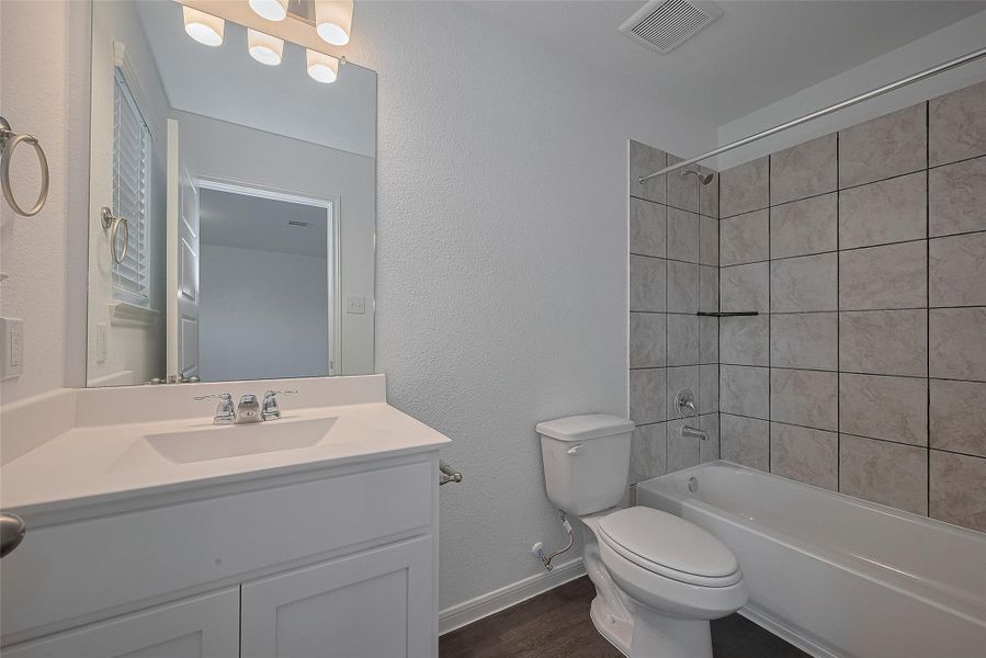 Furnished interior view inside a new home in Mill Creek Trails, Magnolia (Image 15).