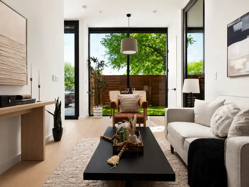 Natural light floods this living area, offering a seamless connection to the private outdoor space. Natural light floods this living area, offering a seamless connection to the private outdoor space.