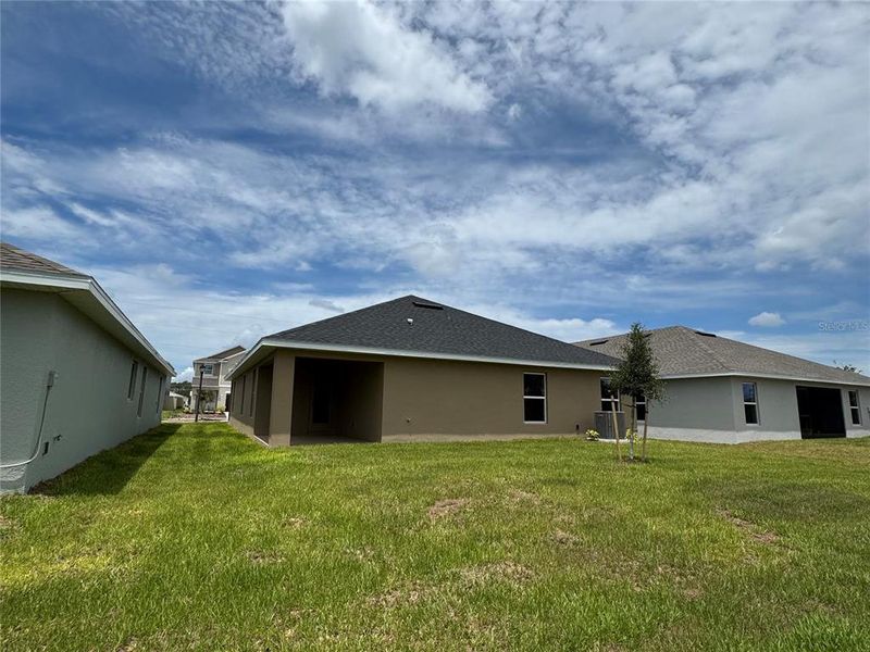 Front exterior of a new home in Harmony Central, Harmony, FL, highlighting curb appeal (Image 18).