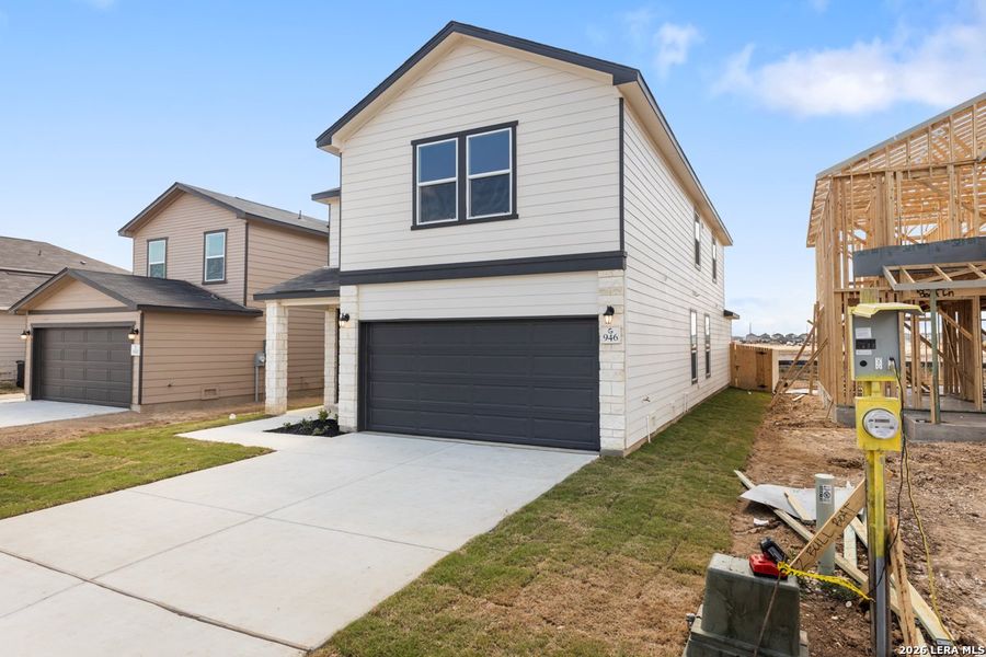 Front exterior of a new home in The Granary - Heritage Collection, San Antonio, TX, highlighting curb appeal (Image 17).