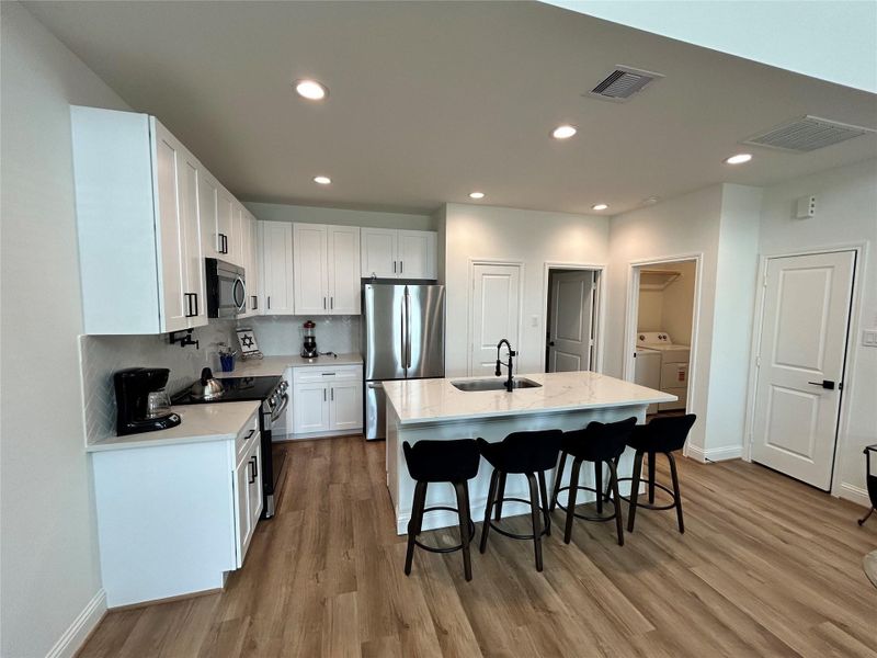 Furnished interior view inside a new home in Spring Branch Crossing, Conroe (Image 8).