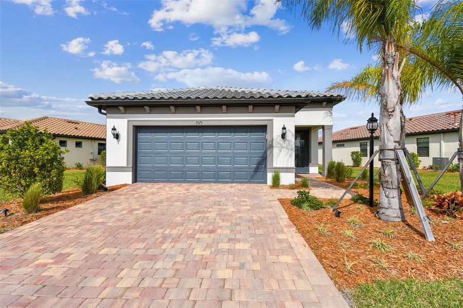 Front of 7575 Summerland Cove...notice the beautiful paver driveway and two car garage. Welcome home!