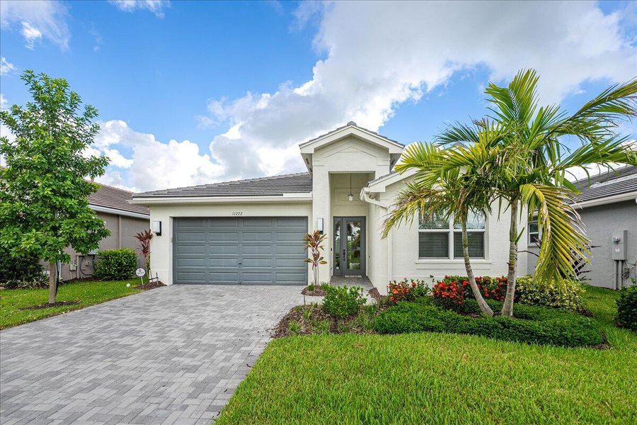 Front exterior of a new home in , Port St. Lucie, FL, highlighting curb appeal (Image 21).