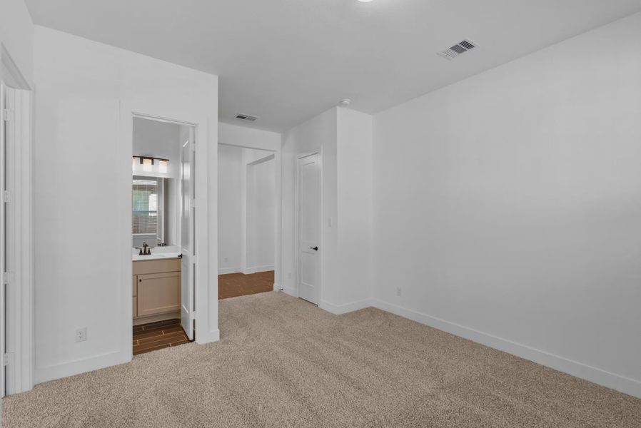Representative unfurnished interior of a home built from the Nicklaus by Chesmar Homes in Riceland Alley Loads, Mont Belvieu (Image 57).