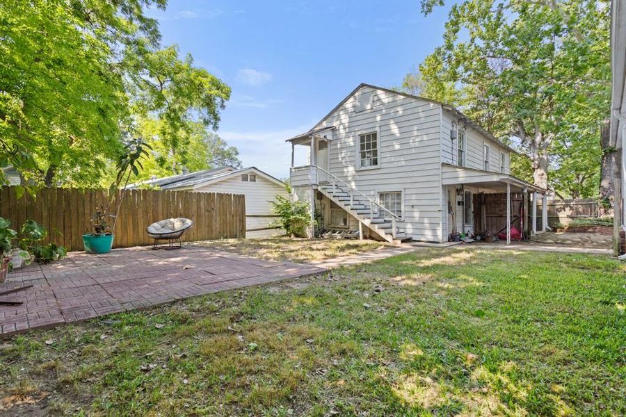 Back of house with a patio area and stairs