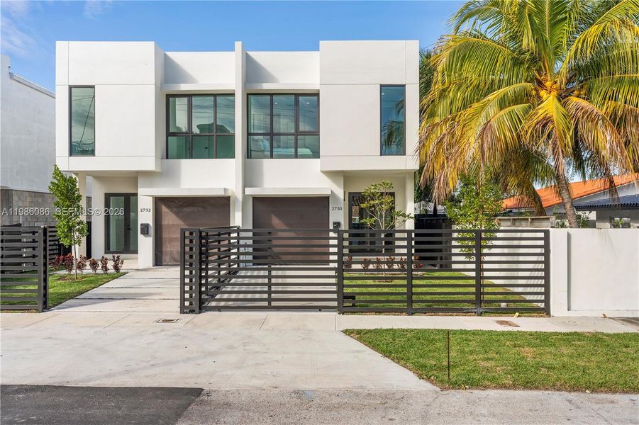 Front exterior of a new home in , Miami, FL, highlighting curb appeal (Image 25). Front exterior of a new home in , Miami, FL, highlighting curb appeal (Image 25).