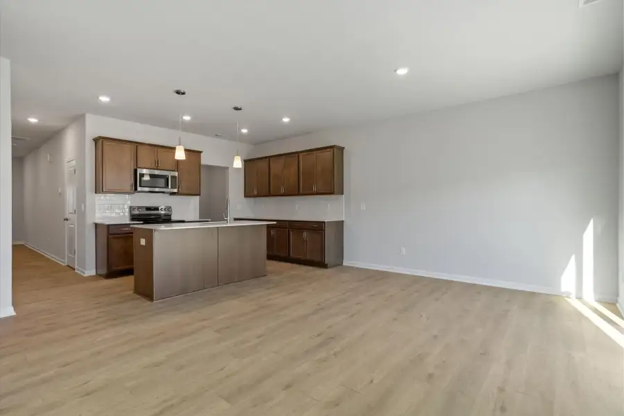 Furnished interior view inside a new home in West Main Townhomes, Sanford (Image 5).