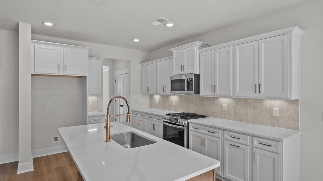 First-rate kitchen with functional layout and a large center island First-rate kitchen with functional layout and a large center island