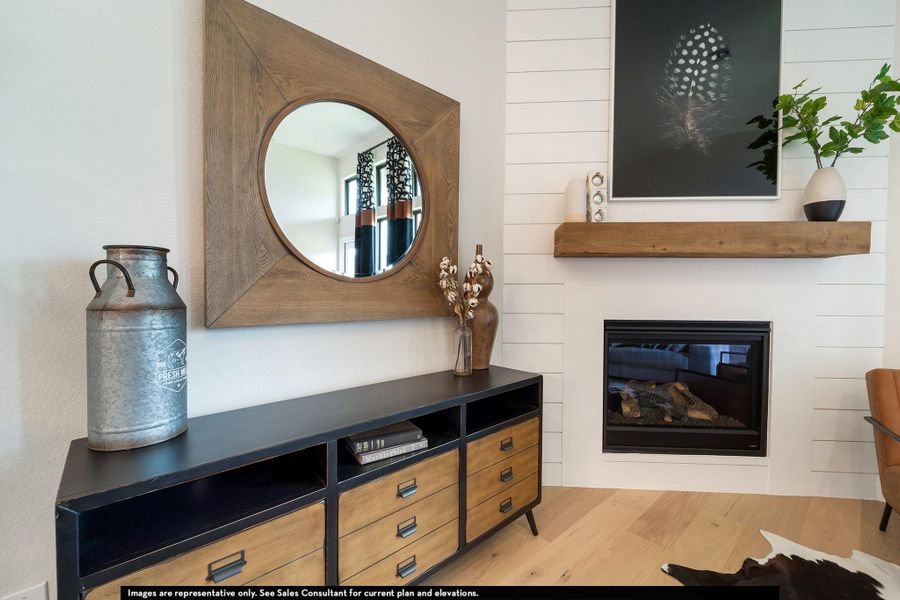 Detailed view of wood finished floors and a glass covered fireplace Detailed view of wood finished floors and a glass covered fireplace