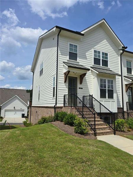 Front exterior of a new home in , Suwanee, GA, highlighting curb appeal (Image 1).