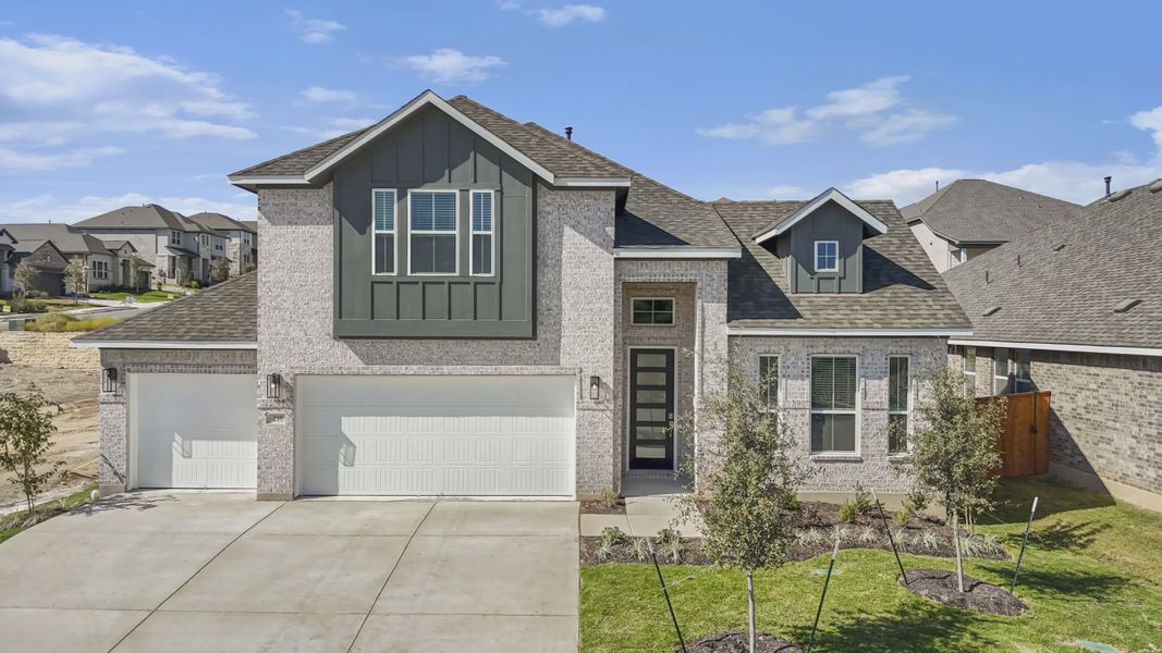 Representative exterior photo of a completed home built from the Grace by Chesmar Homes in Lariat, Liberty Hill, TX (Image 1). Representative exterior photo of a completed home built from the Grace by Chesmar Homes in Lariat, Liberty Hill, TX (Image 1).