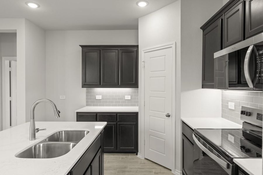 Representative furnished interior of a home built from the Birch by Impression Homes in Churchill, Anna (Image 8).