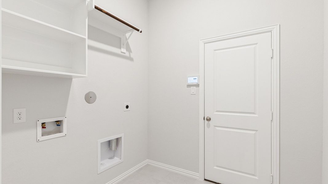 Furnished interior view inside a new home in Sunterra, Katy (Image 15).