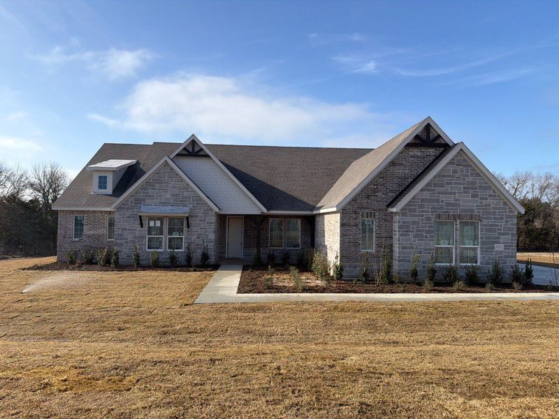 Front exterior of a new home in Grayson Ridge, Van Alstyne, TX, highlighting curb appeal (Image 1). Front exterior of a new home in Grayson Ridge, Van Alstyne, TX, highlighting curb appeal (Image 1).