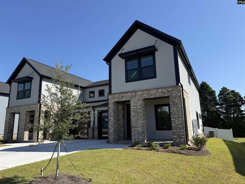 Front exterior of a new home in Dunbar Village, Cayce, SC, highlighting curb appeal (Image 1).