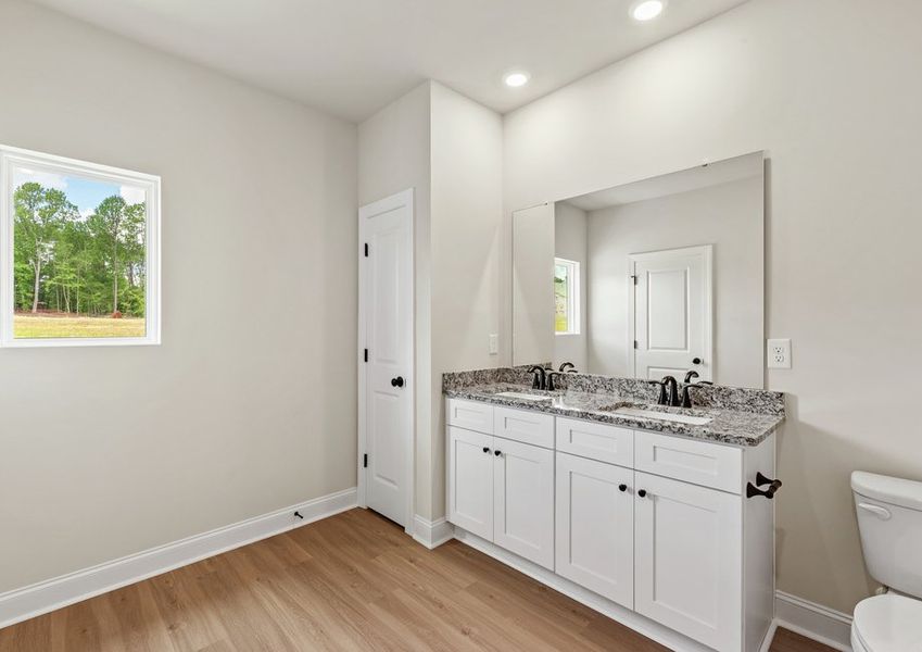 The master bathroom has a glass-enclosed shower