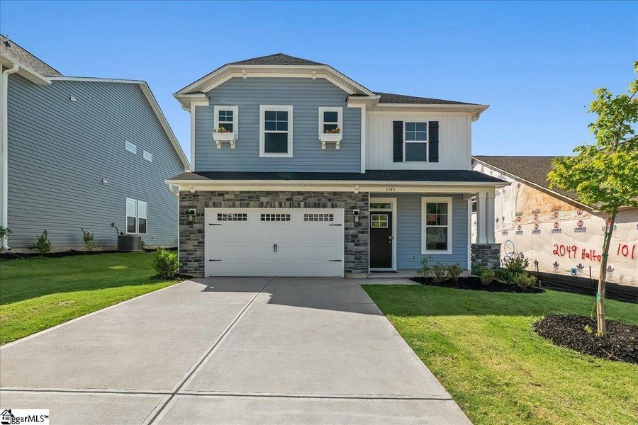 Front exterior of a new home in Halton Oaks, Spartanburg, SC, highlighting curb appeal (Image 1). Front exterior of a new home in Halton Oaks, Spartanburg, SC, highlighting curb appeal (Image 1).