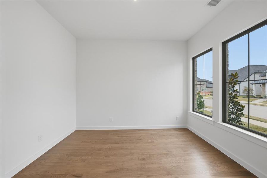 Unfurnished room with wood finished floors