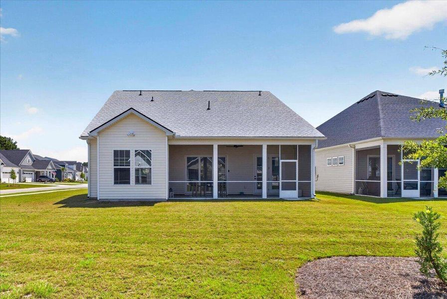 Exterior details and patio area of a home in Summerwind Crossing at Lakes of Cane Bay, Summerville (Image 26).