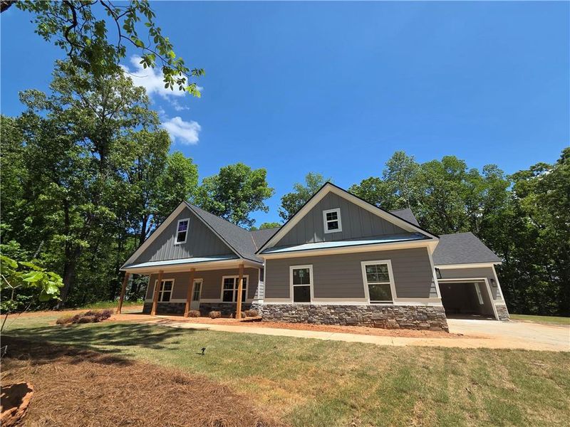 Front exterior of a new home in , Dallas, GA, highlighting curb appeal (Image 2). Front exterior of a new home in , Dallas, GA, highlighting curb appeal (Image 2).