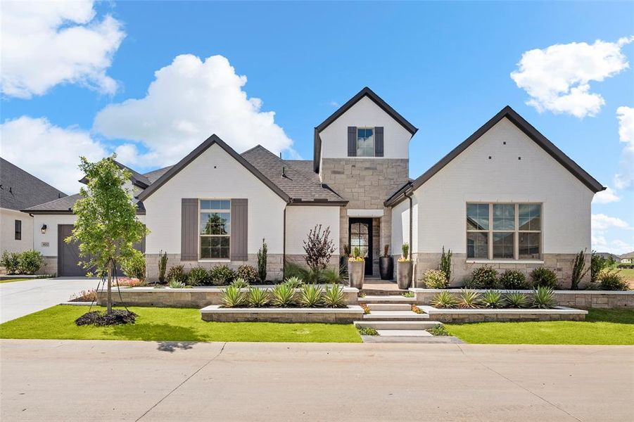 Front exterior of a new home in Robson Ranch Texas, Denton, TX, highlighting curb appeal (Image 1). Front exterior of a new home in Robson Ranch Texas, Denton, TX, highlighting curb appeal (Image 1).