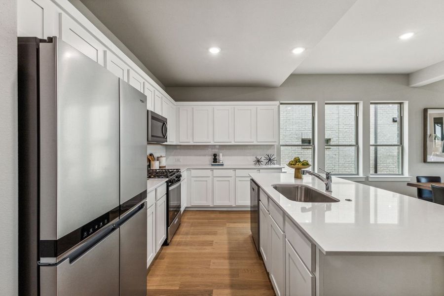 Kitchen in the Stanley II home plan by Trophy Signature Homes – REPRESENTATIVE PHOTO