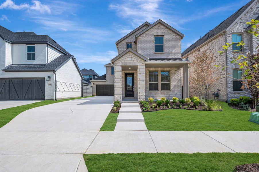 Front exterior of a new home in Union Park, Little Elm, TX, highlighting curb appeal (Image 1). Front exterior of a new home in Union Park, Little Elm, TX, highlighting curb appeal (Image 1).