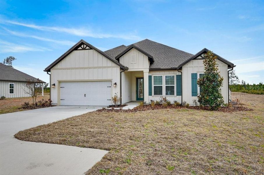 Front exterior of a new home in Stables at Cary Forest, Bryceville, FL, highlighting curb appeal (Image 23).