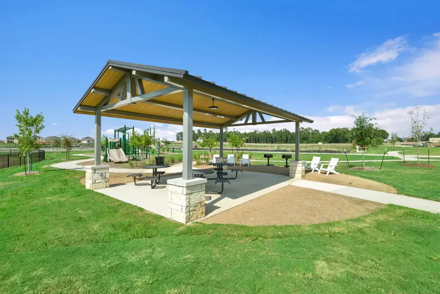 The community pavilion is the perfect spot for outdoor gatherings, featuring a picnic area and grills for residents to enjoy.